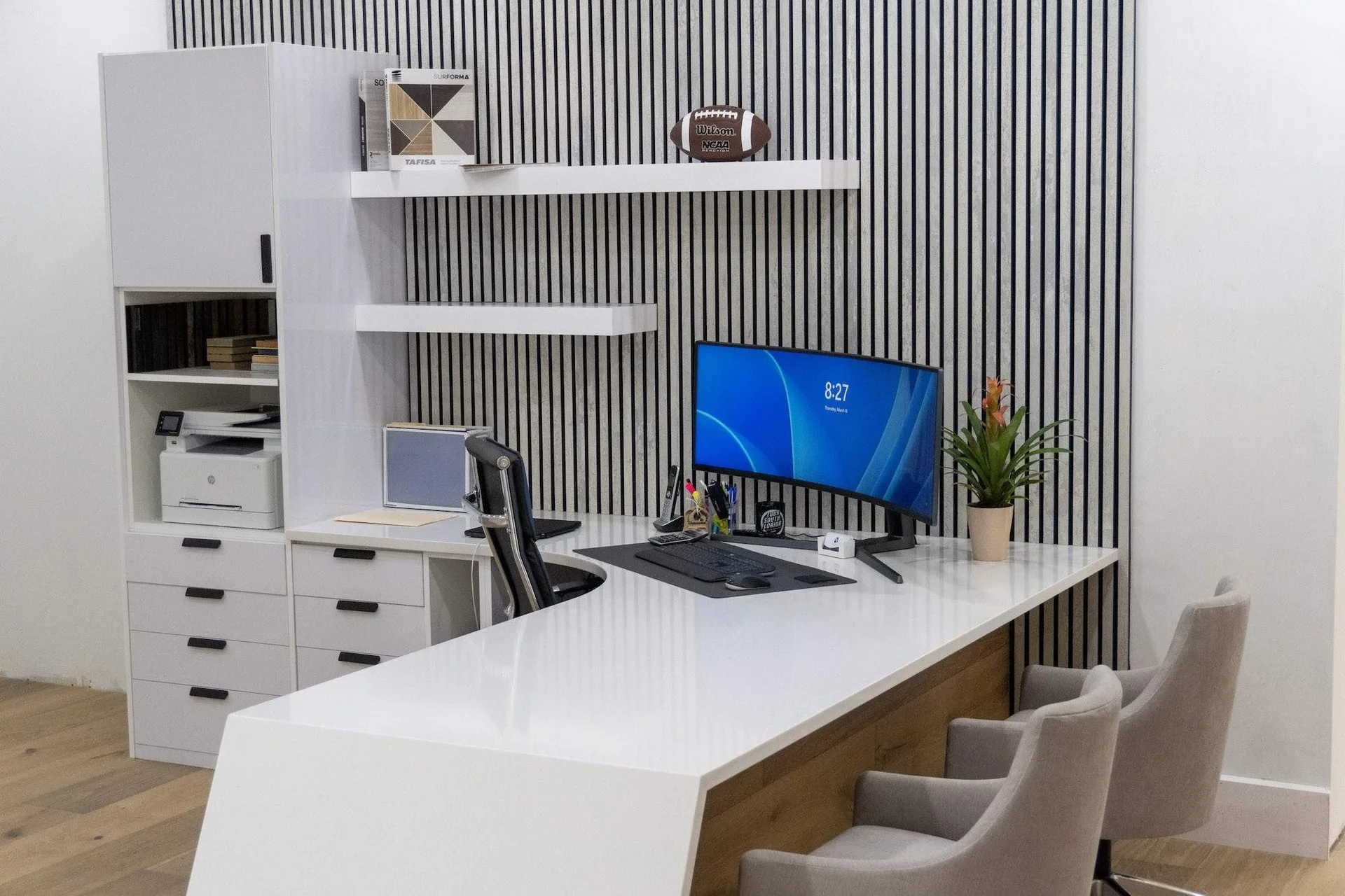 Modern office space with white desk and computer monitor